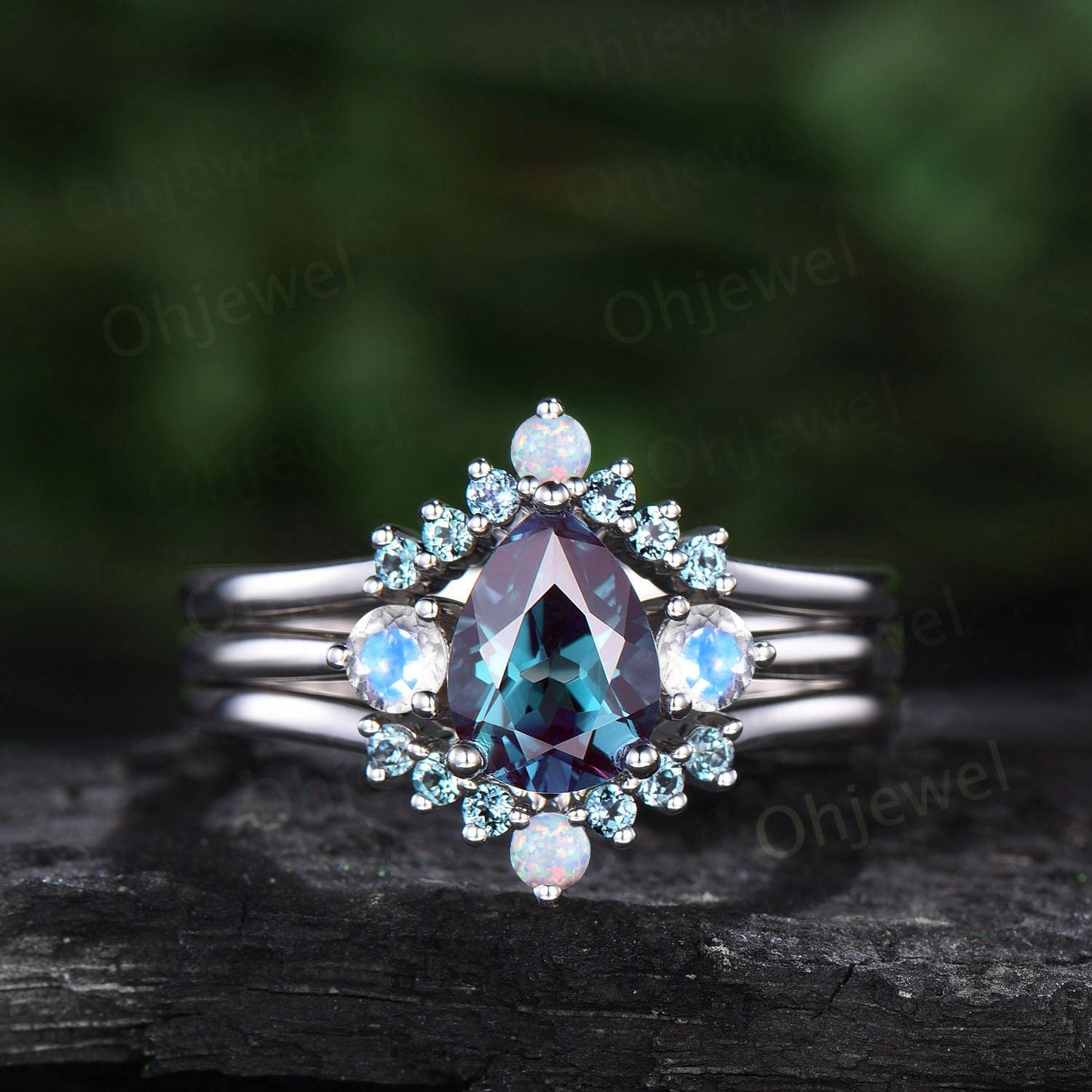 Pear shaped alexandrite engagement ring set three stone moonstone