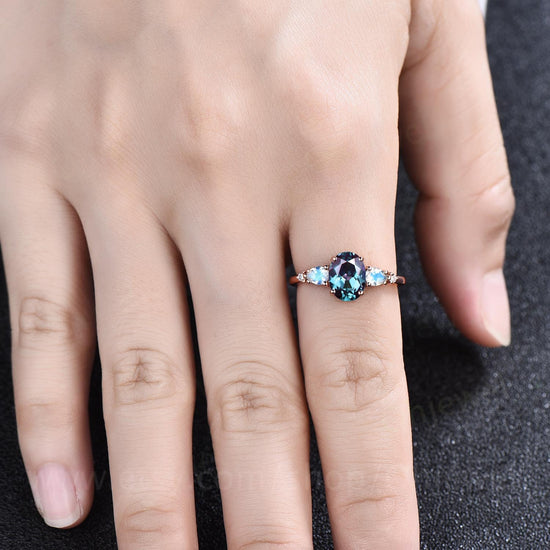 Unique oval cut Alexandrite engagement ring set five stone minimalist